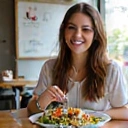 Client Emily R. enjoying healthy food